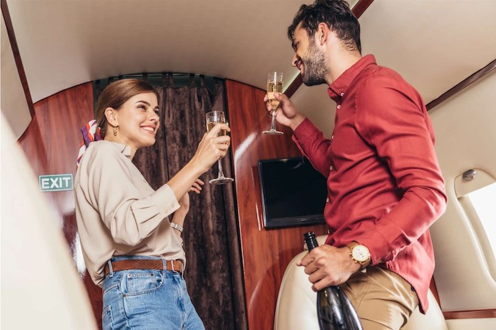 Toast with champagne. Private jet in Ibiza