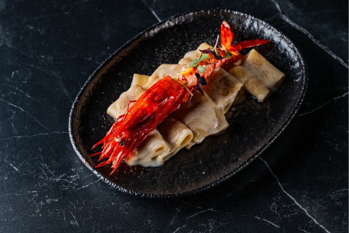 La Pasta Nostra. Paccheri pasta with caccio e pepe and scarlet prawn