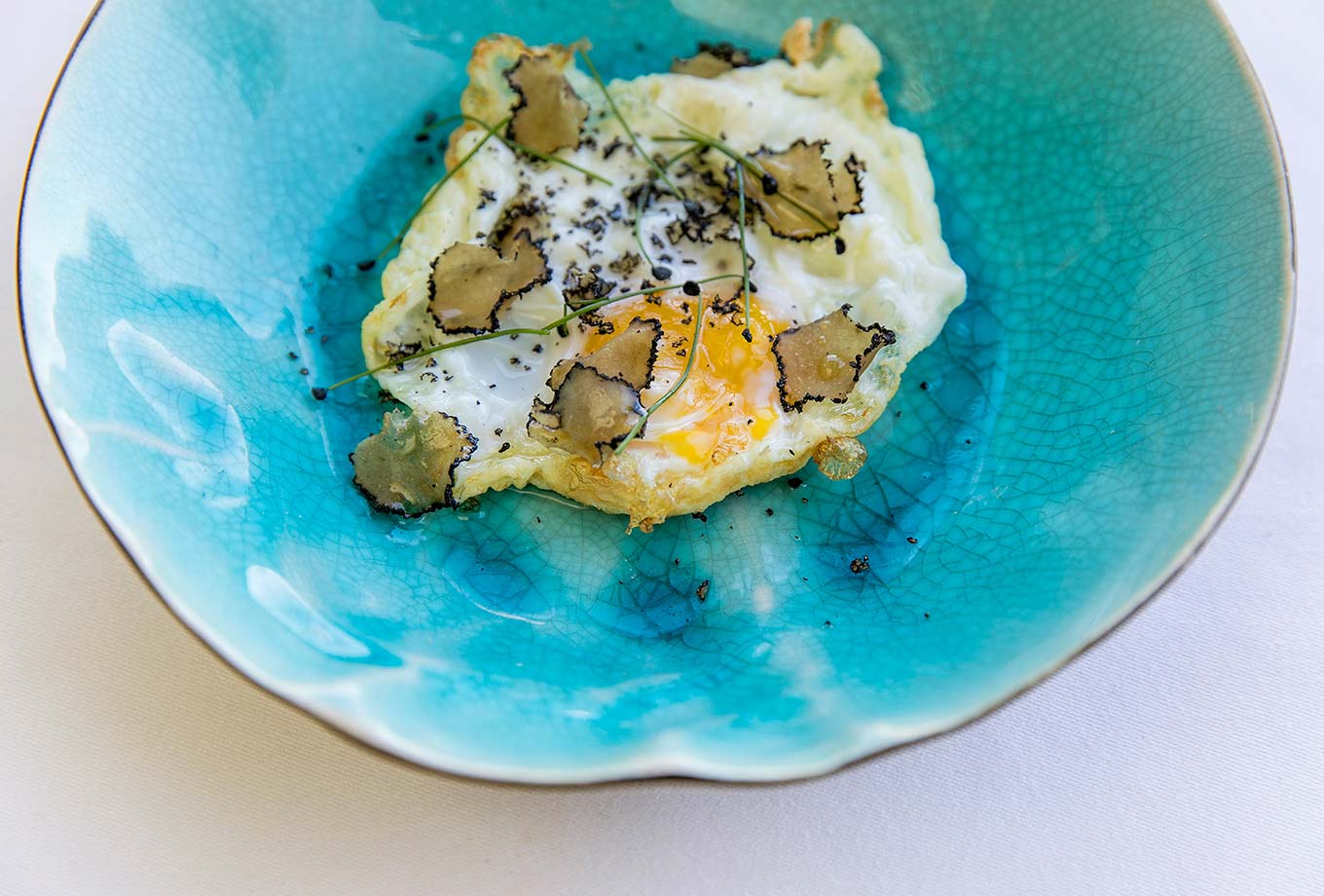 Truffled fried eggs. Arrels by Marga Coll Truffled fried eggs. Arrels by Marga Coll