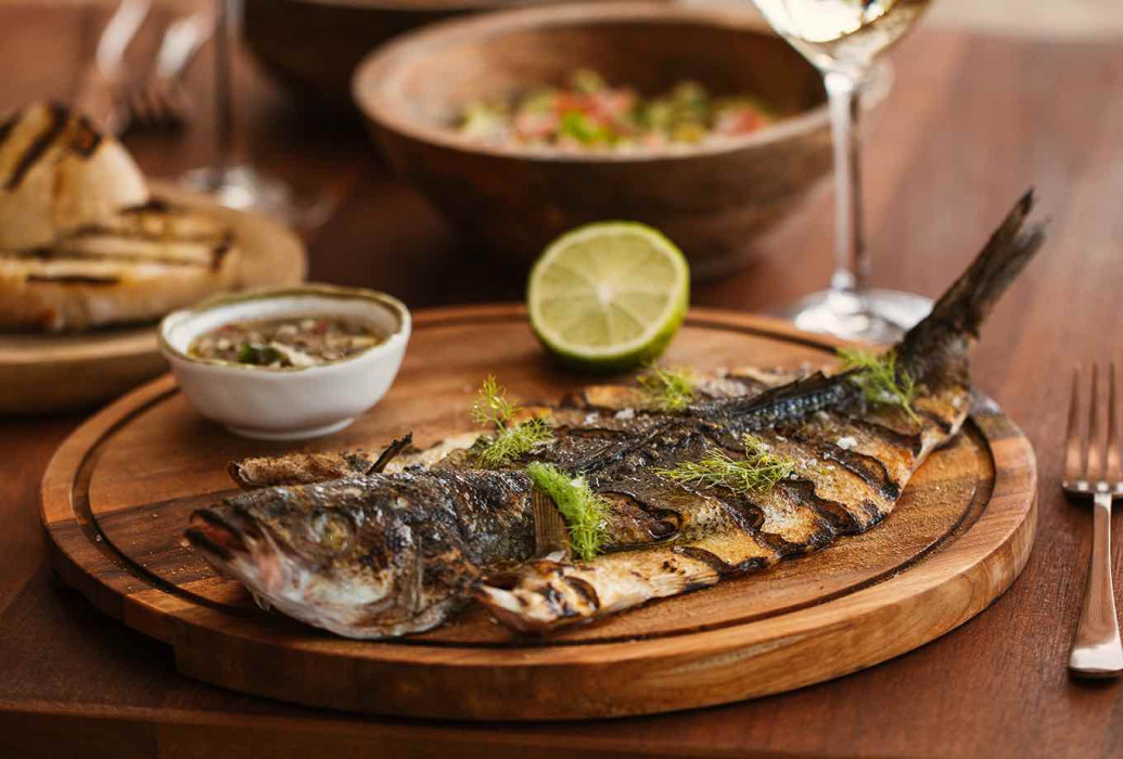 Roasted fish. Monkey Ibiza restaurant Roasted fish. Monkey Ibiza restaurant