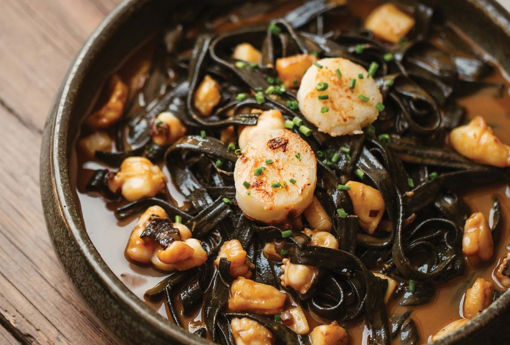 Black ink tagliatelle with monkfish, shrimp, scallops, cuttlefish. La Luna Nell' Orto restaurante Black ink tagliatelle with monkfish, shrimp, scallops, cuttlefish. La Luna Nell' Orto restaurante
