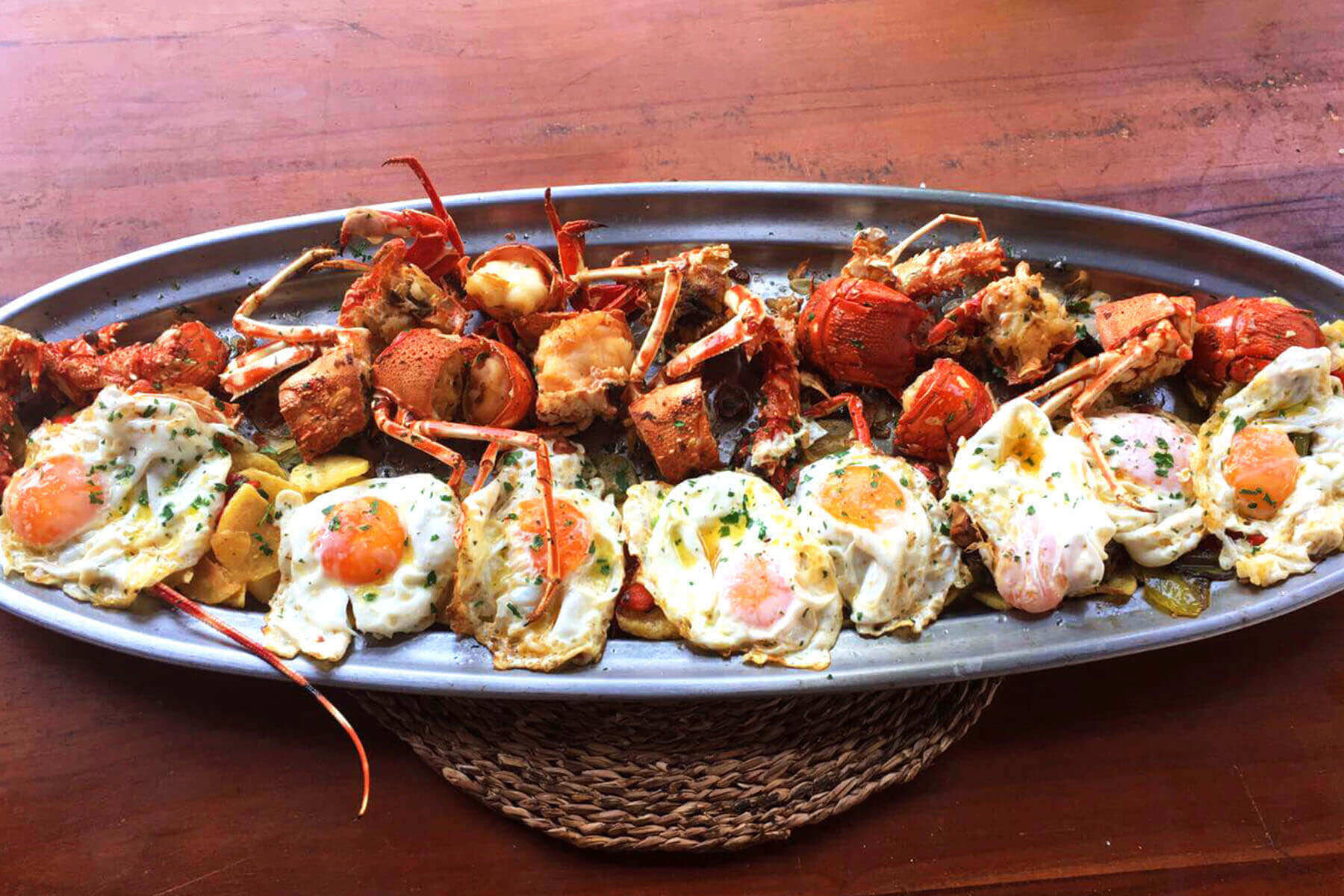 Lobster with fried eggs and Ibiza potatoes